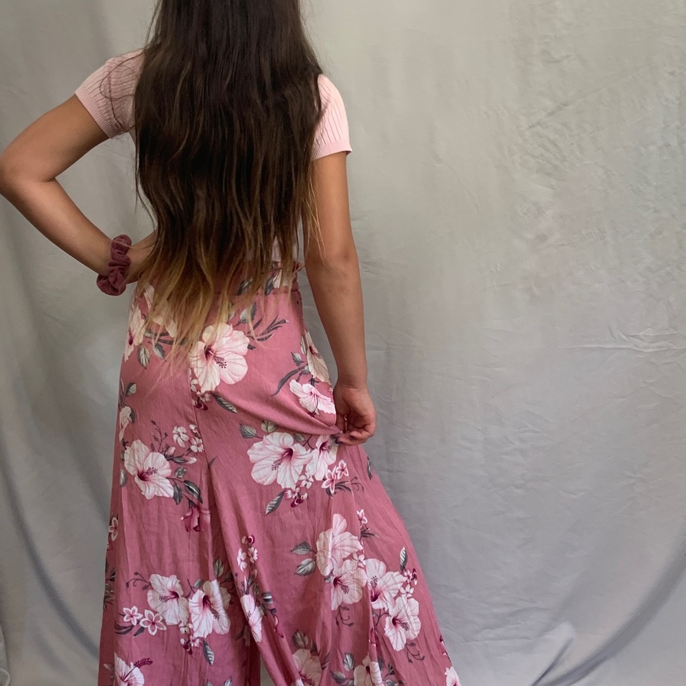 Cute pink crop top with floral pantsuit bottom and matching purse